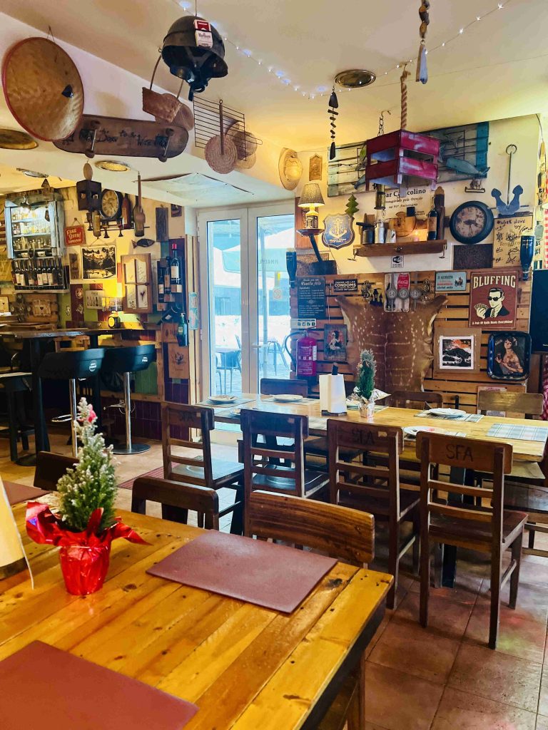 The cozy and inviting interior of Tasco do Strauss, a family-run eatery in Sintra recommended by locals for its delicious traditional Portuguese cuisine